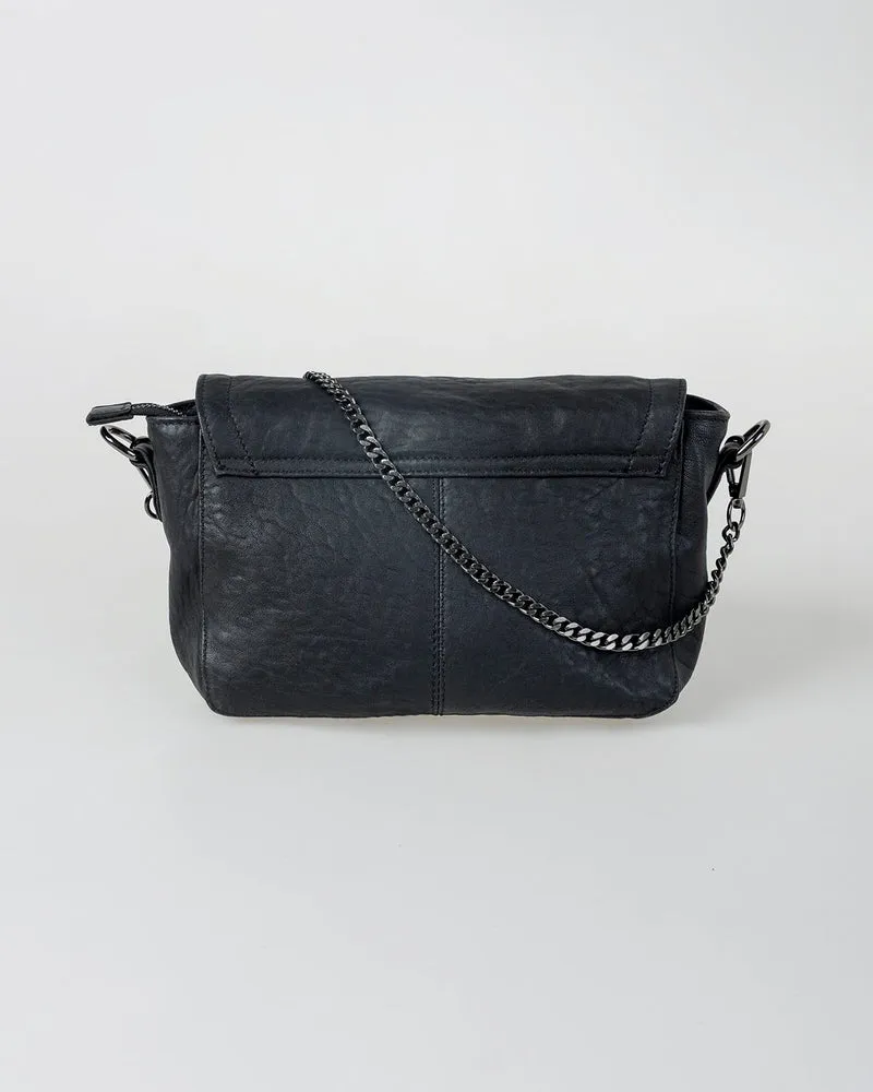 Bolso piel tachas