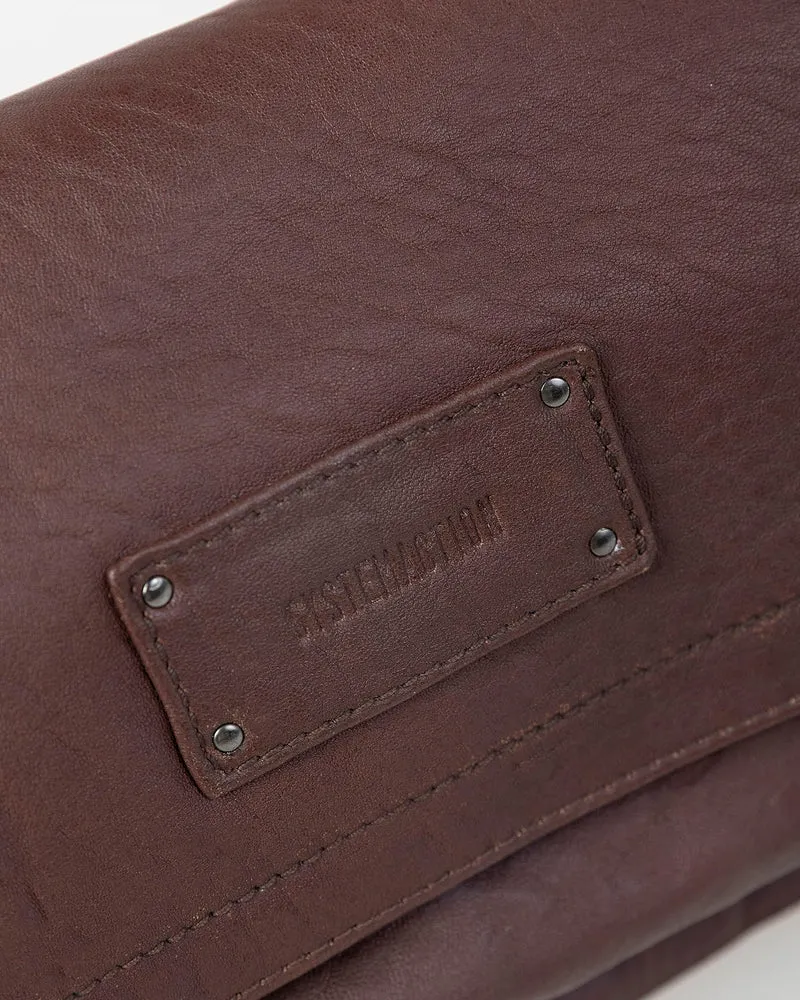 Bolso piel tachas